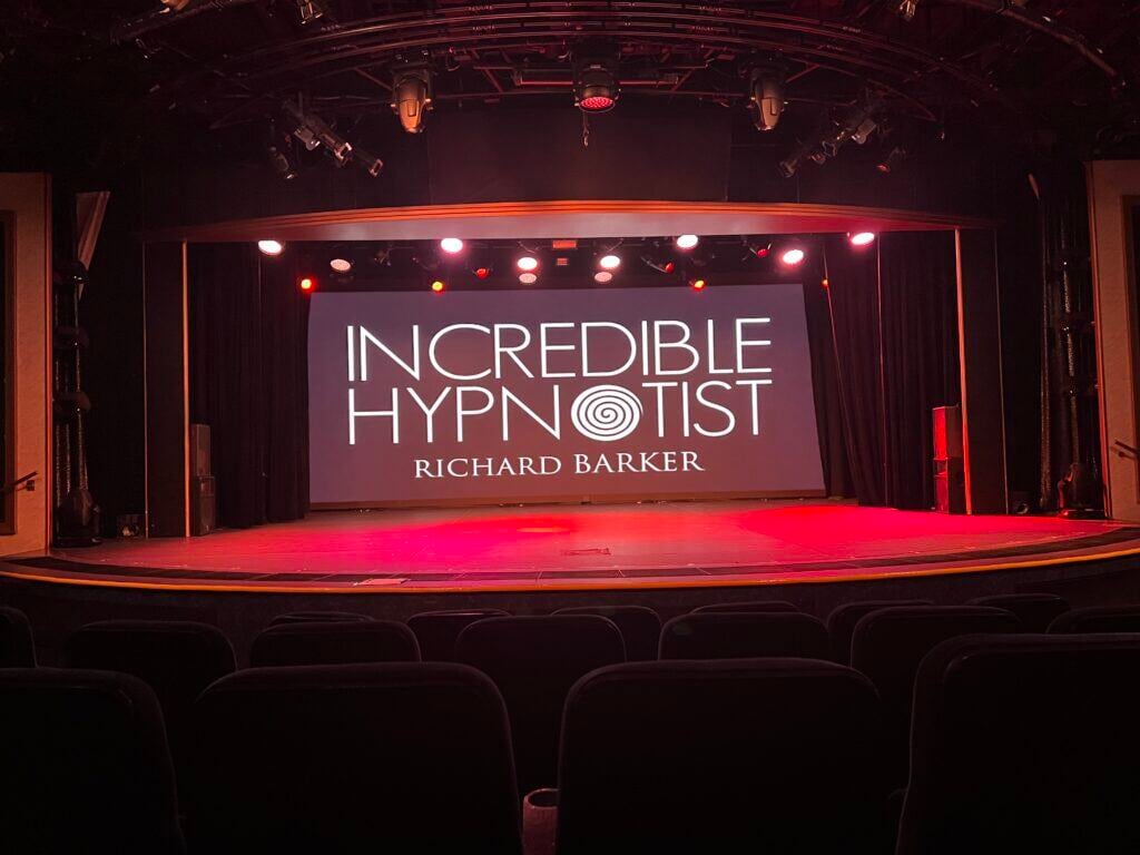 Richard Barker performing comedy hypnosis show in London theatre