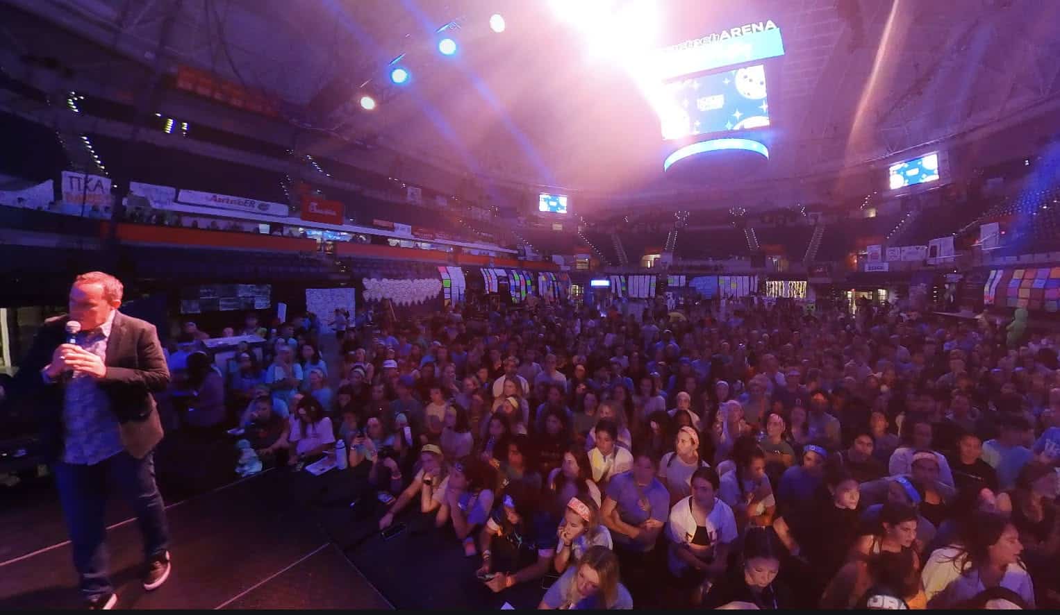 College hypnotist Richard Barker performing to thousands of students at a university arena