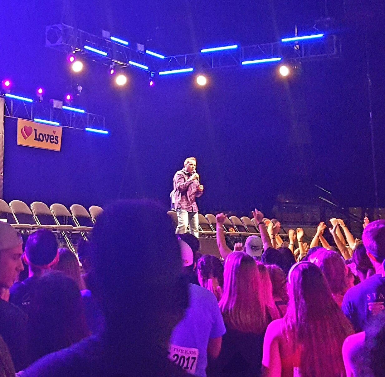 Comedy hypnotist Richard Barker performing at a corporate arena event
