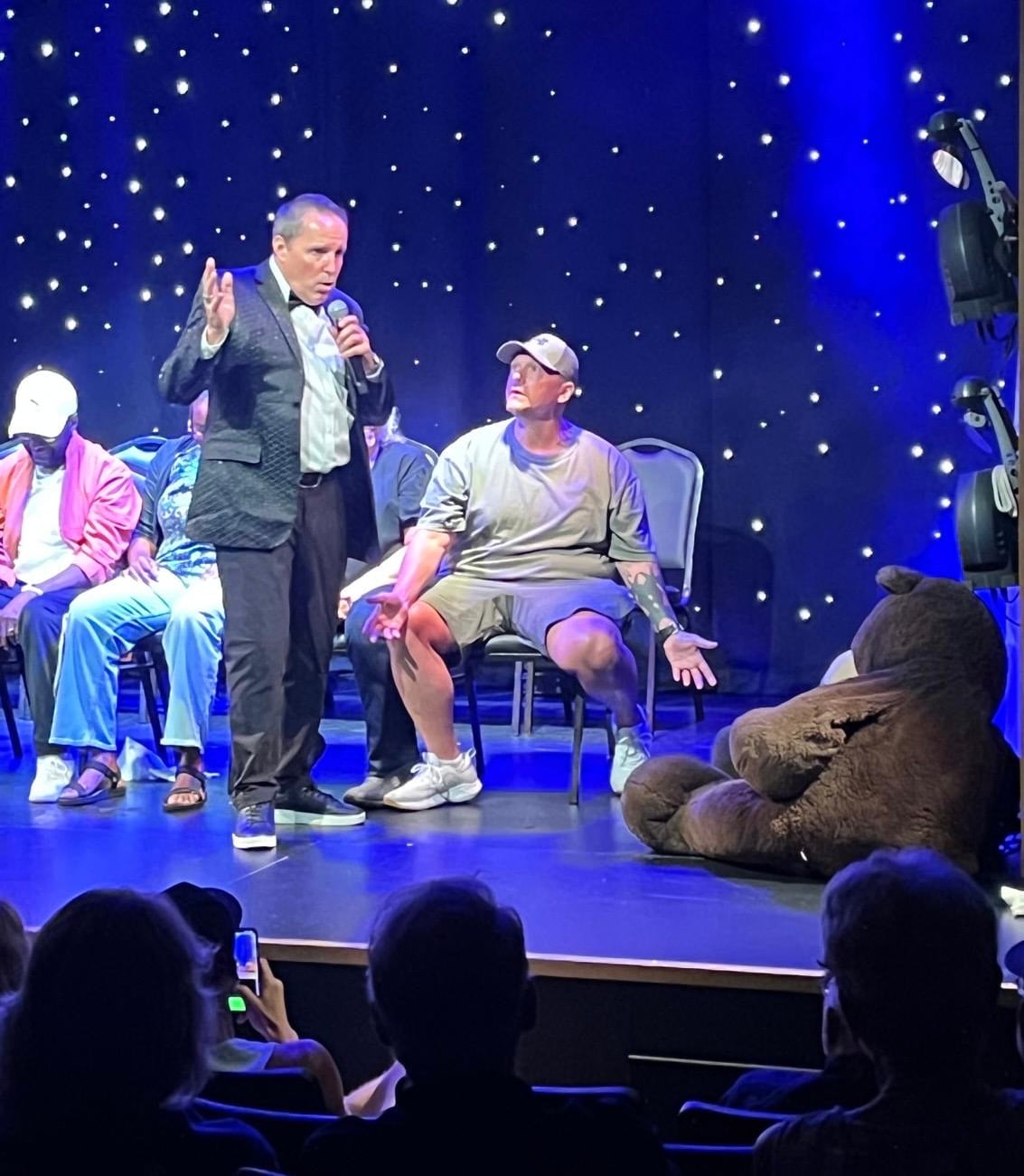 Richard Barker hypnotizing audience volunteers on stage at the Wonders Theatre in Myrtle Beach